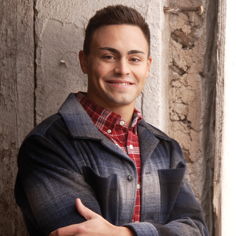 Michael Alfonso standing with his arms crossed