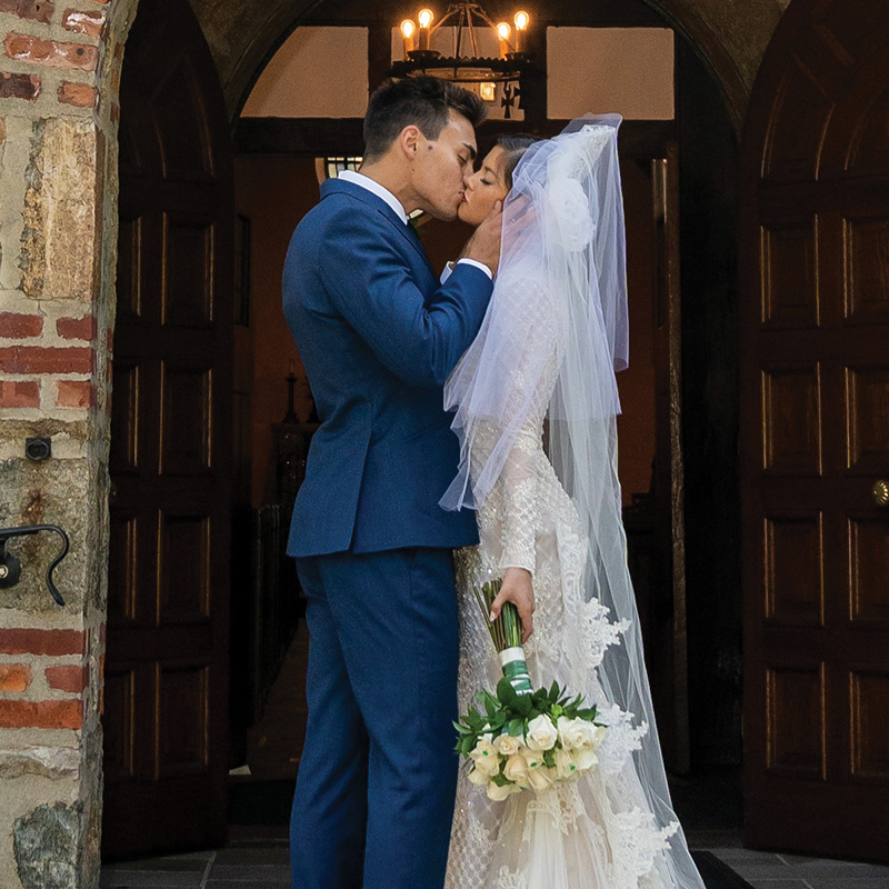 Michael Alfonso kissing his wife at their wedding ceremony