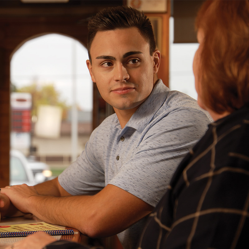 Michael Alfonso listening to a voter’s concerns